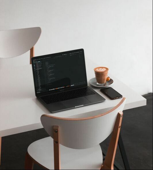 Laptop and coffee set for someone starting their side hustle